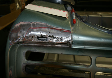 Rusty end of 67 GTO quarter panel.