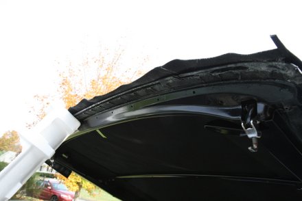 Spray adhesive applied to header bow tack strip area GTO convertible
