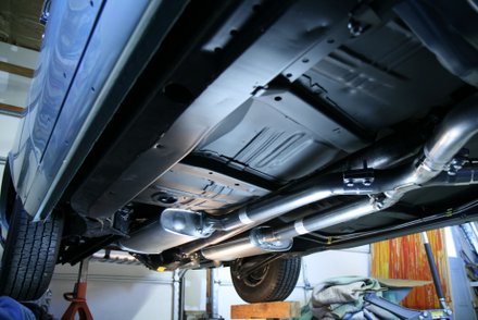 Hovering GTO undergoing Pypes exhaust installation