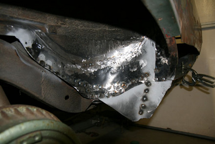 Plug welded wheelwell metal to trunk pan flanges Pontiac GTO