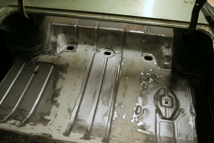 Body filler added to new trunk pan seams on 67 GTO